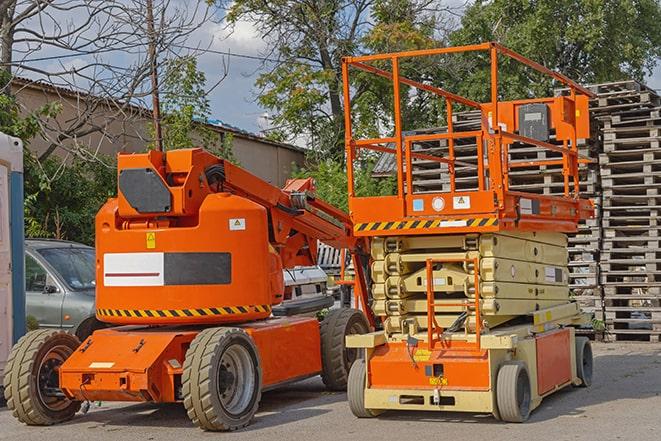 forklift loading pallets in a warehouse environment in Converse