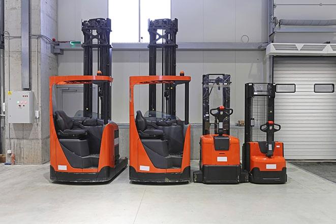 forklift loading pallets in a distribution center